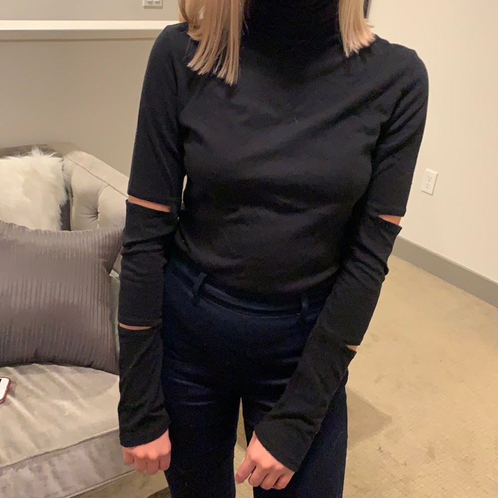 n: Philanthropy black turtleneck